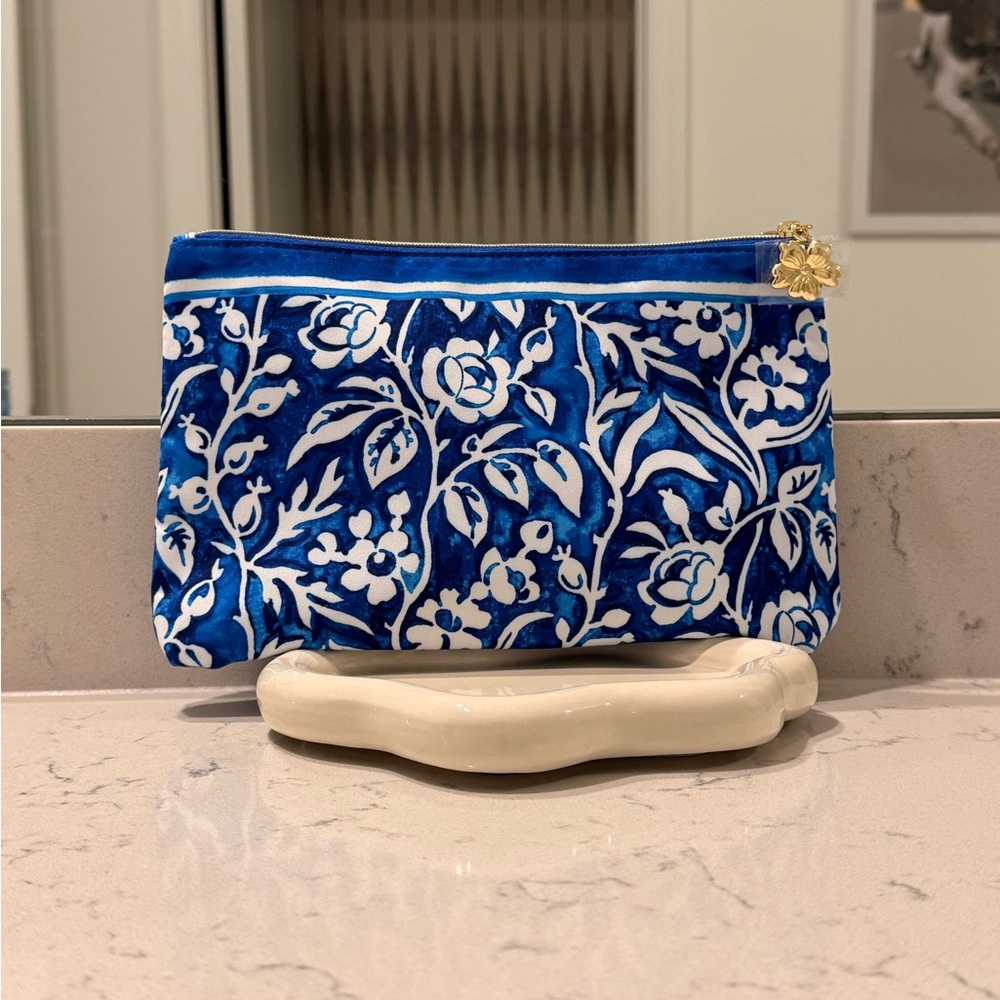 Blue and White Floral Pouch (Estee Lauder) with brand new sealed ulta products